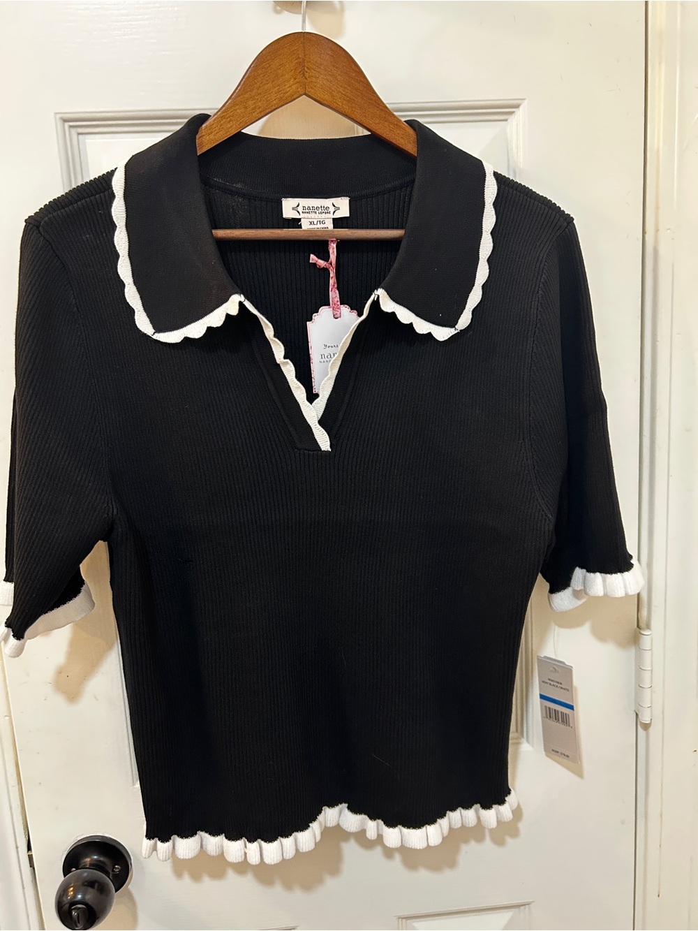 Nanette Lepore black short sleeve sweater white trim. XL